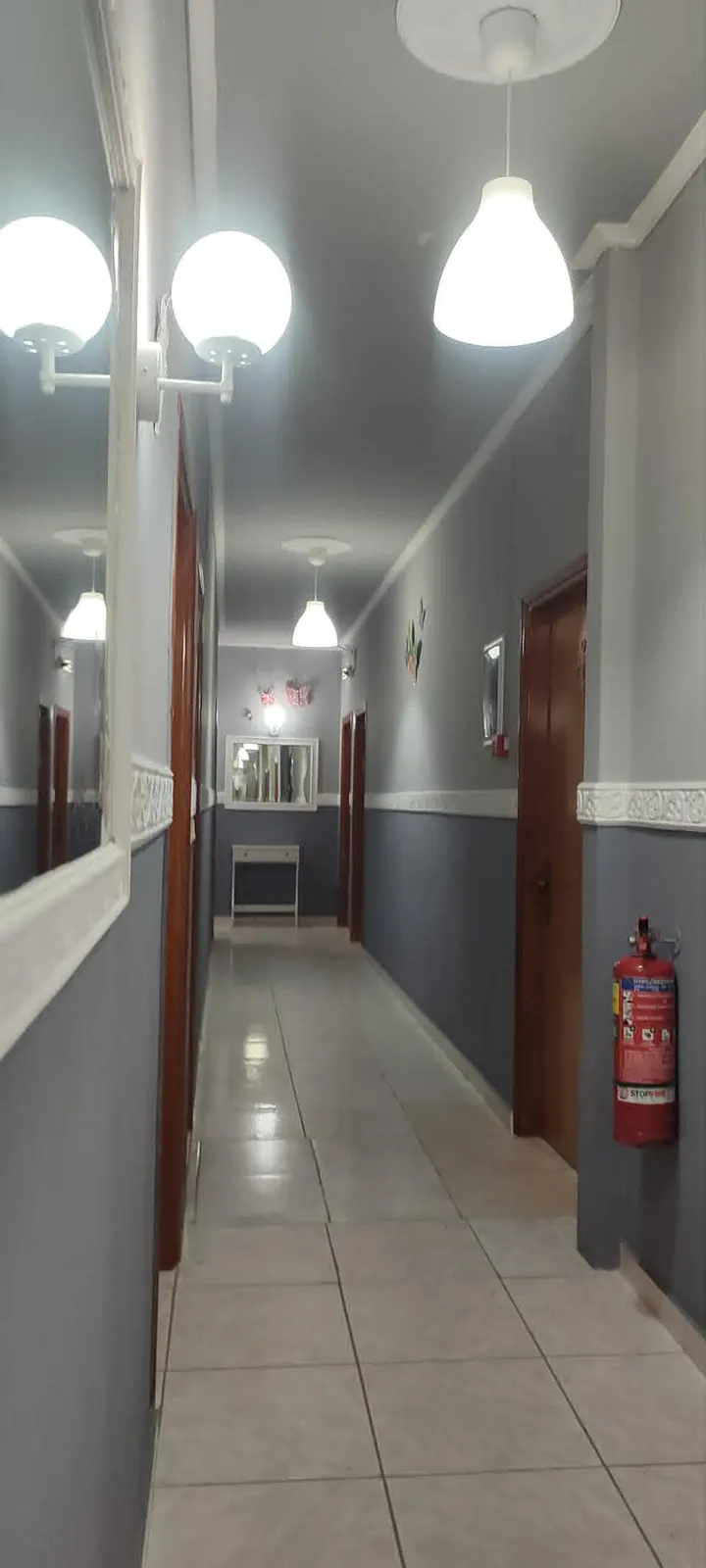 Interior corridor with mirror and fittings