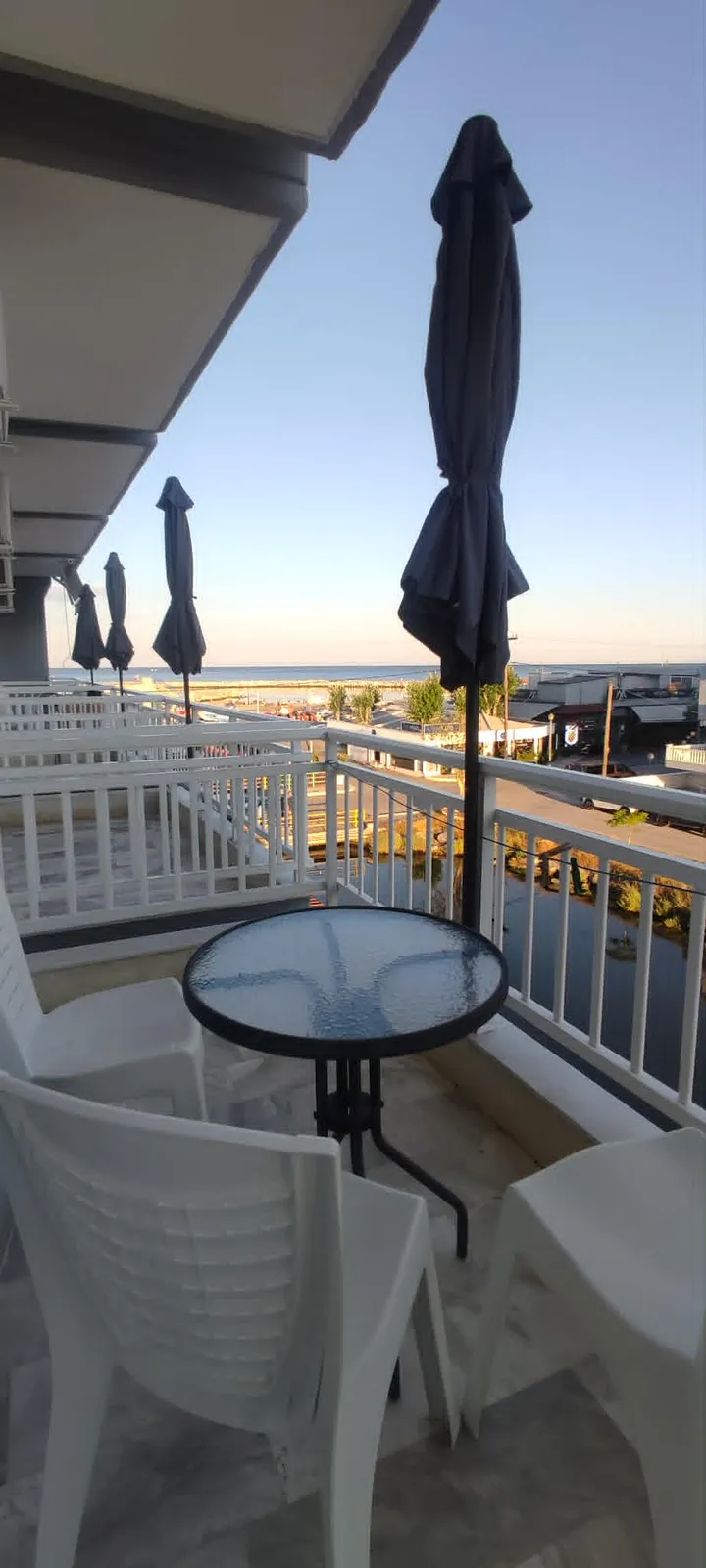 Balcony table for two with sea view at golden hour